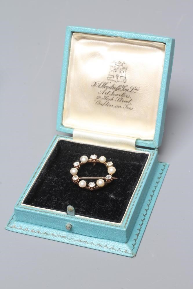 A LATE VICTORIAN DIAMOND AND PEARL CIRCLET BROOCH Image