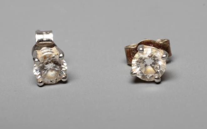 A PAIR OF DIAMOND SOLITAIRE EAR STUDS, the brilliant cut stones each of approximately 0.30cts claw Image