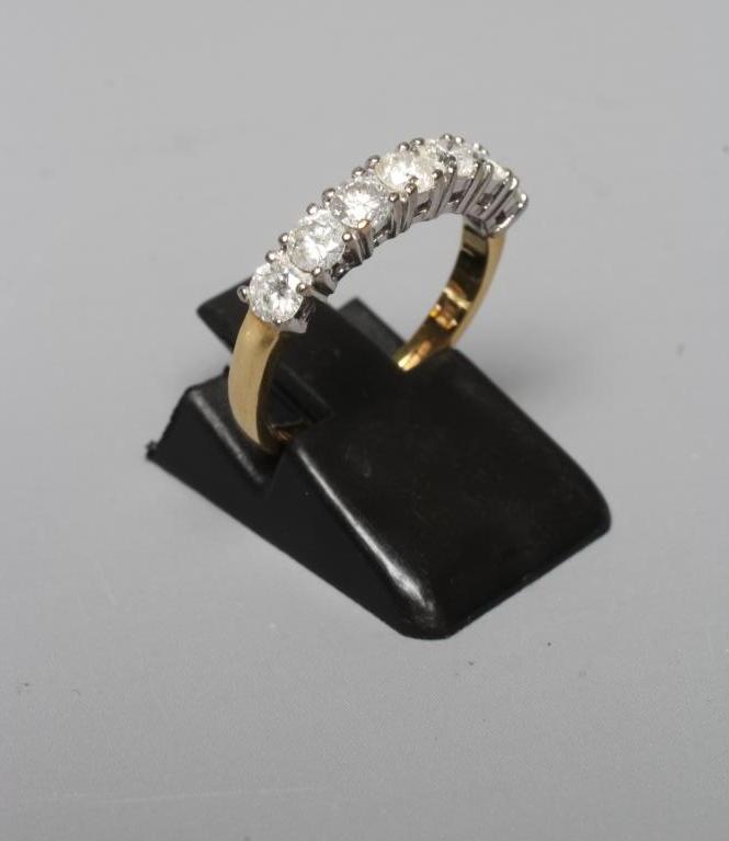 A SEVEN STONE DIAMOND HALF HOOP ETERNITY RING Image