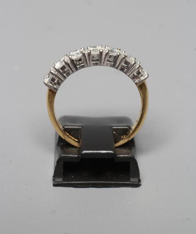 A SEVEN STONE DIAMOND HALF HOOP ETERNITY RING Image