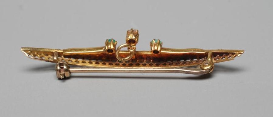 AN EDWARDIAN SEED PEARL CRESCENT BROOCH claw set with two facet cut small emeralds and a diamond on Image