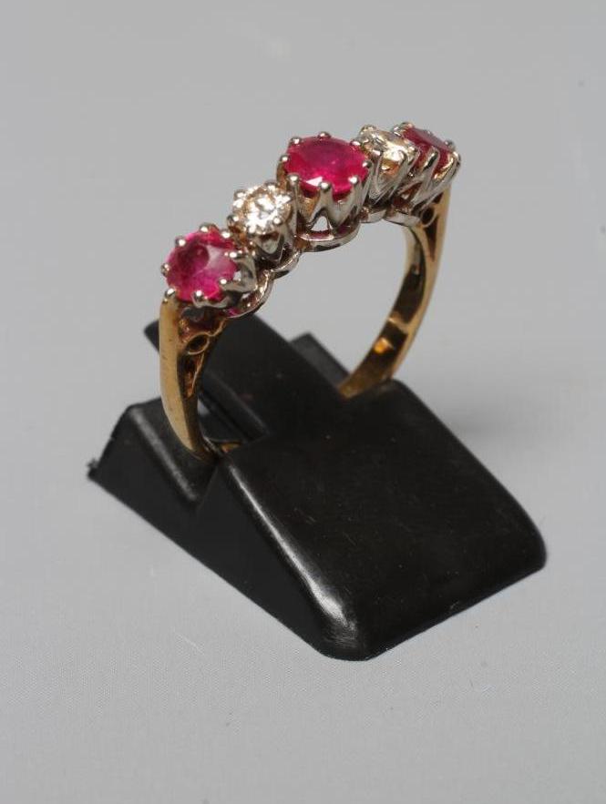 A RUBY AND DIAMOND FIVE STONE RING Image
