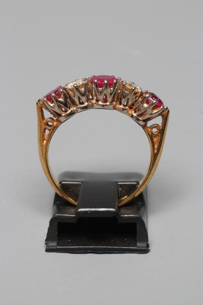 A RUBY AND DIAMOND FIVE STONE RING Image
