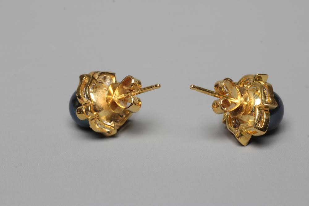 A PAIR OF BLACK CULTURED PEARL AND DIAMOND CLUSTER EAR STUDS set to plain posts and butterflies, Image