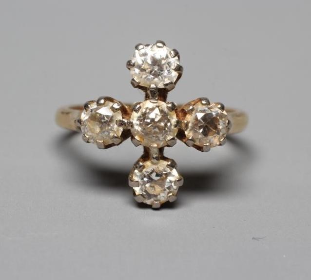 A FIVE STONE DIAMOND RING, the old brilliant cut stones each of approximately 0.25cts, claw set to a Image