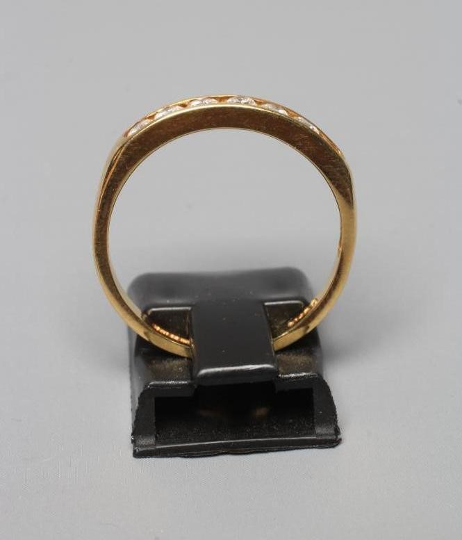 A SEVEN STONE DIAMOND HALF HOOP ETERNITY RING, the brilliant cut stones totalling 0.5cts, channel Image