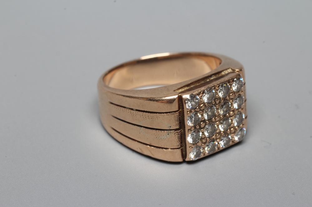 A GENTLEMAN'S DIAMOND SIGNET RING, the sixteen brilliant cut stones grain set to a square plaque Image