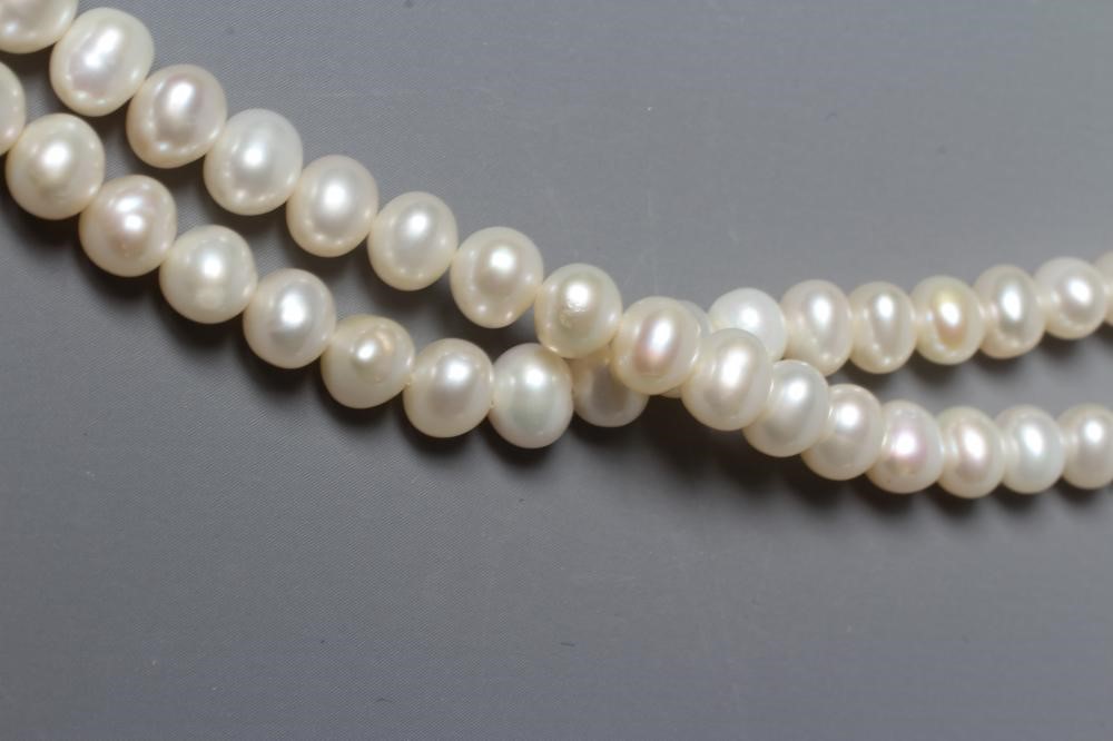 A DOUBLE STRAND FRESHWATER PEARL NECKLACE with gilt metal clasp (Est. plus 24% premium inc. VAT) Image