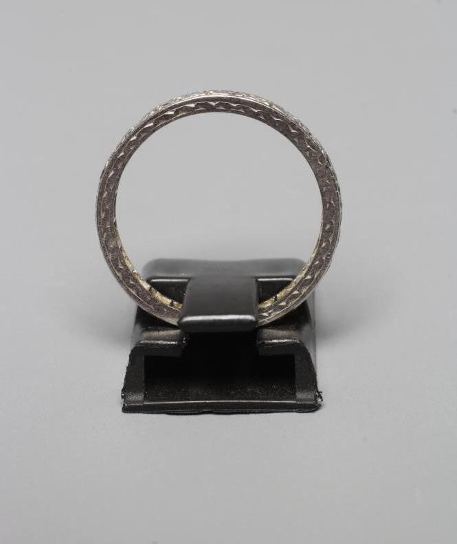 A DIAMOND ETERNITY RING, the mix cut small stones point set to an engraved shank stamped PLAT, size Image