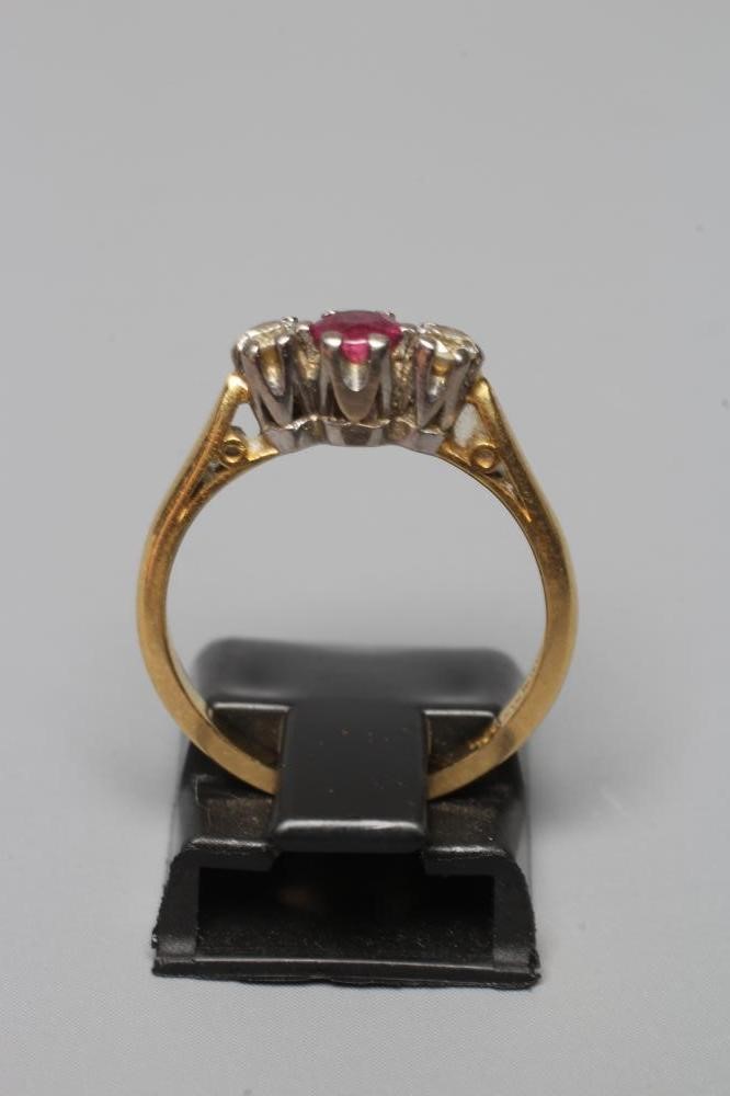 A THREE STONE RUBY AND DIAMOND RING Image