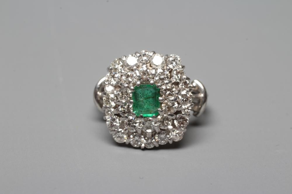 AN EMERALD AND DIAMOND CLUSTER COCKTAIL RING Image