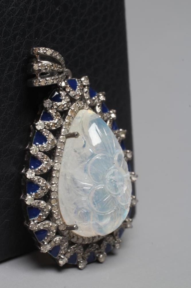 A MOONSTONE AND DIAMOND PENDANT Image