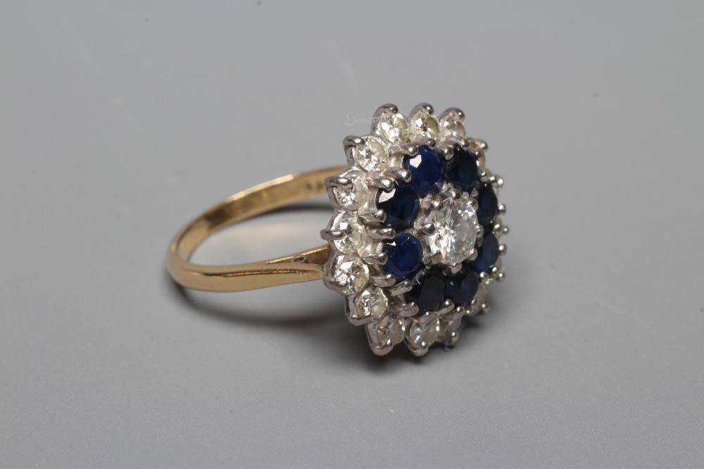 A SAPPHIRE AND DIAMOND CLUSTER RING Image