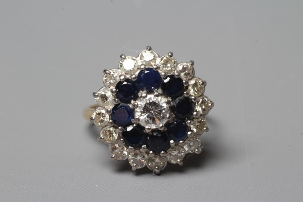 A SAPPHIRE AND DIAMOND CLUSTER RING Image