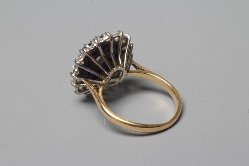 A SAPPHIRE AND DIAMOND CLUSTER RING Image