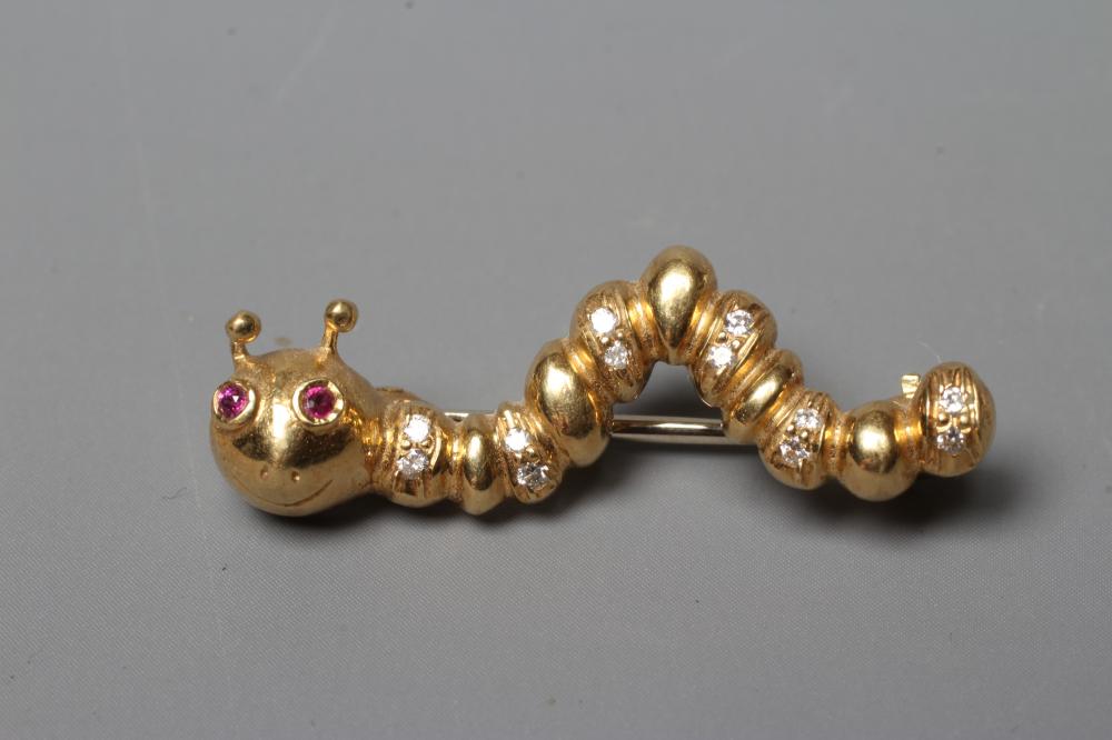 AN 18CT GOLD NOVELTY CATERPILLAR BROOCH set with two facet cut ruby eyes and with six pairs of Image