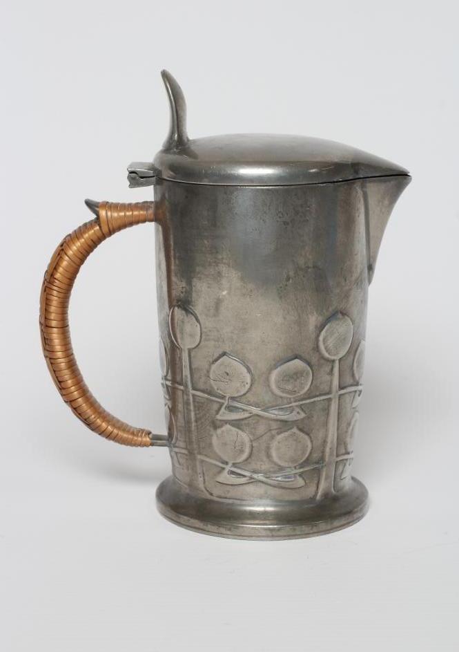 ARCHIBALD KNOX FOR LIBERTY - an English Pewter hot milk jug of cylindrical form Image