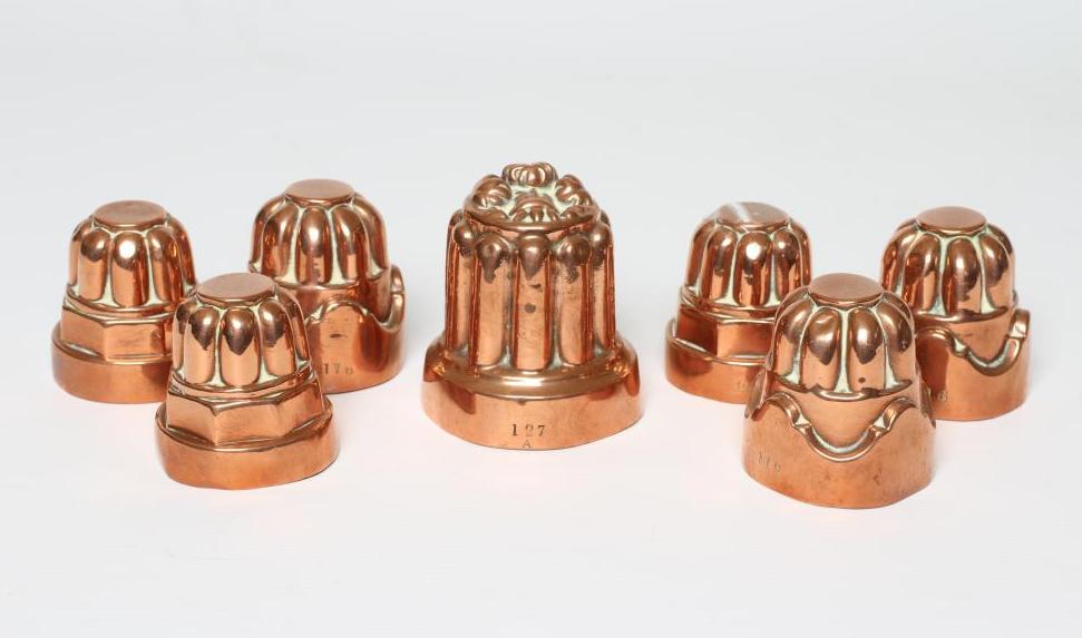 TWO SETS OF THREE SMALL VICTORIAN COPPER JELLY MOULDS of fluted tapering cylindrical form Image