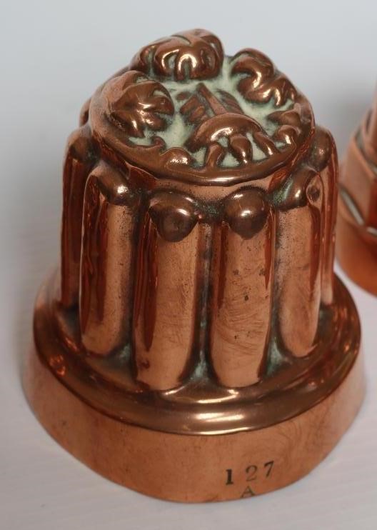 TWO SETS OF THREE SMALL VICTORIAN COPPER JELLY MOULDS of fluted tapering cylindrical form Image