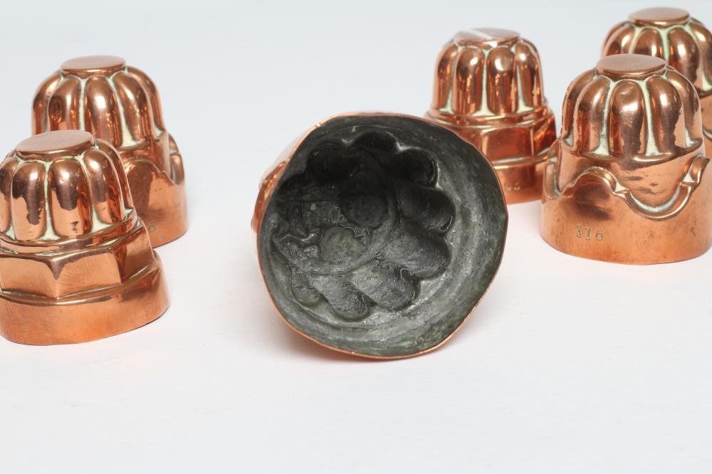 TWO SETS OF THREE SMALL VICTORIAN COPPER JELLY MOULDS of fluted tapering cylindrical form Image