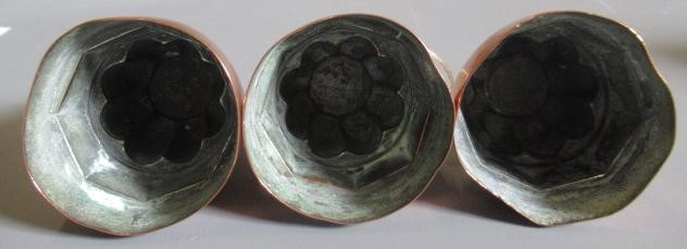TWO SETS OF THREE SMALL VICTORIAN COPPER JELLY MOULDS of fluted tapering cylindrical form Image