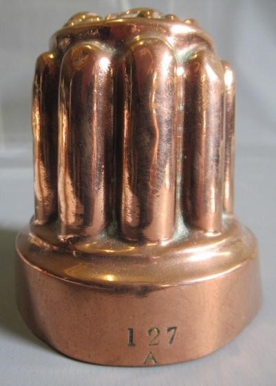 TWO SETS OF THREE SMALL VICTORIAN COPPER JELLY MOULDS of fluted tapering cylindrical form Image