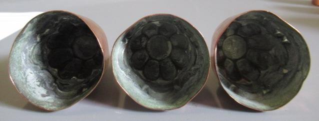 TWO SETS OF THREE SMALL VICTORIAN COPPER JELLY MOULDS of fluted tapering cylindrical form Image