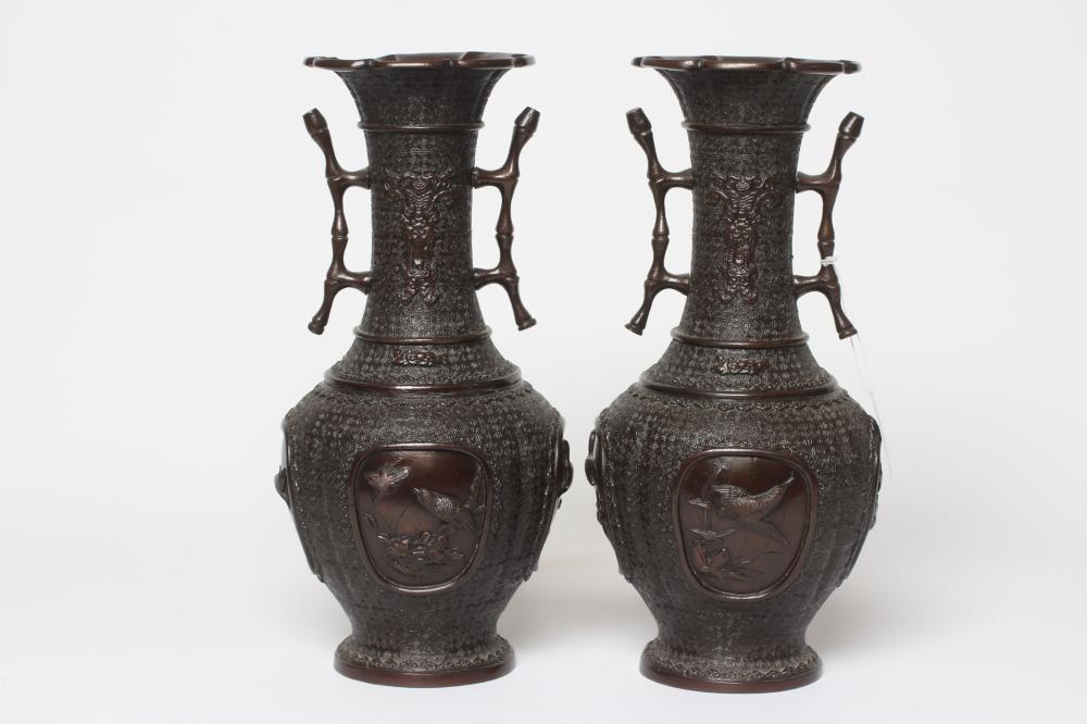 A PAIR OF CHINESE BRONZE VASES of two handled baluster form with cast decoration including high Image