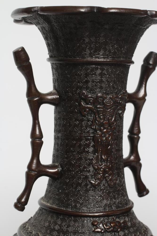 A PAIR OF CHINESE BRONZE VASES of two handled baluster form with cast decoration including high Image