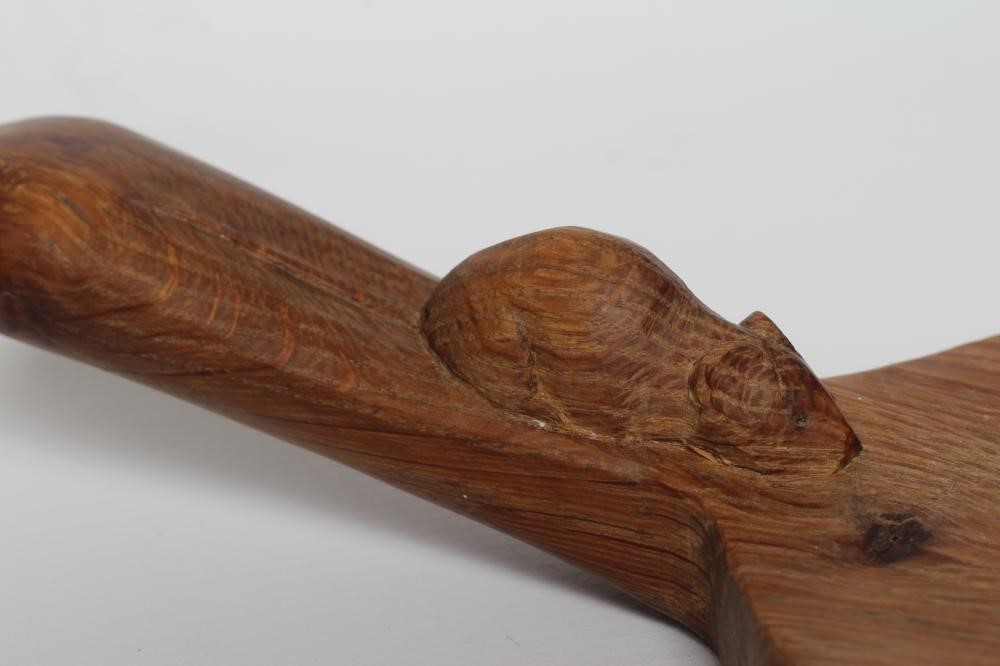 A ROBERT THOMPSON ADZED OAK OVAL CHEESEBOARD with carved mouse trademark, 15" long (Est. plus 24% Image