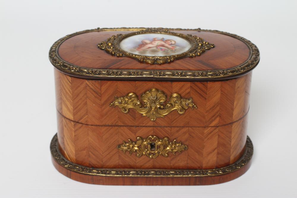 A LOUIS XV STYLE KINGWOOD OVAL TRINKET BOX, early 20th century, with metal mounts and inset Sevres Image