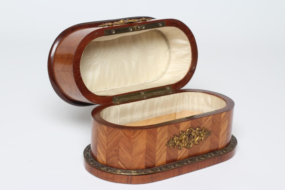 A LOUIS XV STYLE KINGWOOD OVAL TRINKET BOX, early 20th century, with metal mounts and inset Sevres Image
