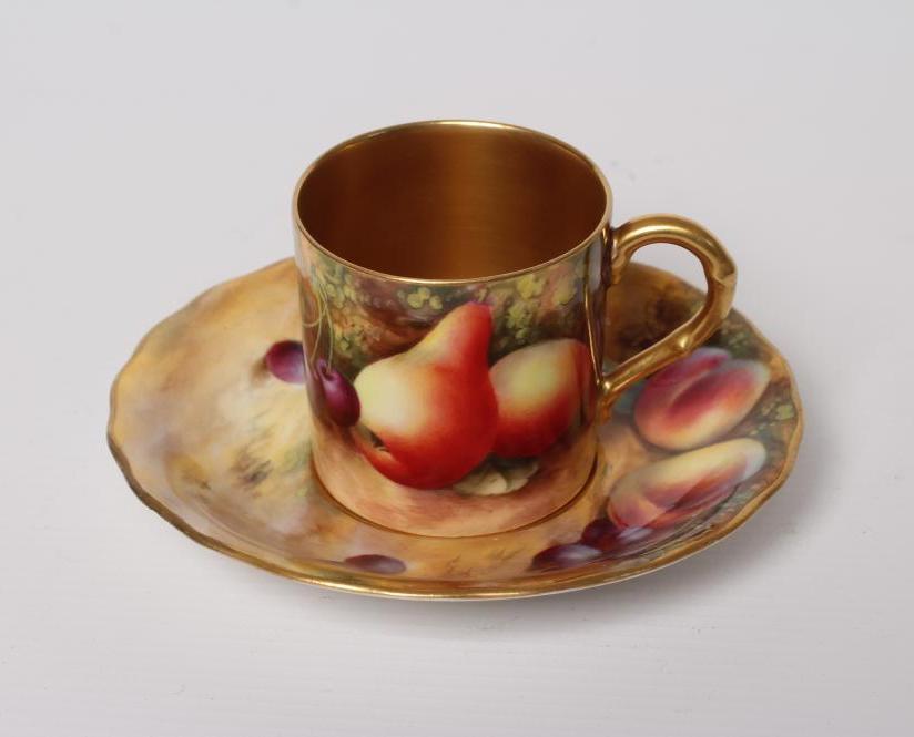 A ROYAL WORCESTER CHINA COFFEE CAN AND SAUCER Image