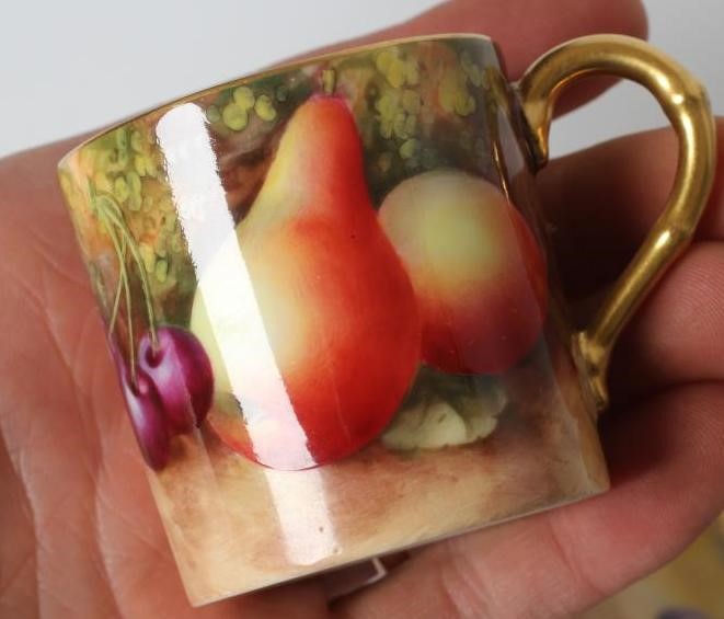 A ROYAL WORCESTER CHINA COFFEE CAN AND SAUCER Image