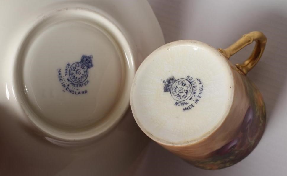 A ROYAL WORCESTER CHINA COFFEE CAN AND SAUCER Image