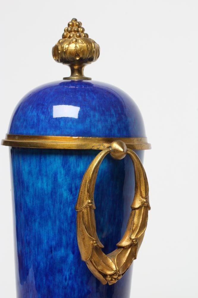 A FRENCH NEOCLASSIC STYLE GARNITURE VASE, 20th century, the blue ceramic tapering body with ormolu Image