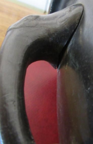 A CHINESE BRONZE JARDINIERE cast in relief with exotic birds set within two panels, flanked by two Image