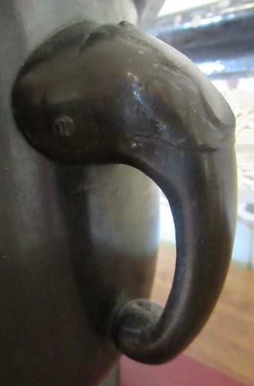 A CHINESE BRONZE JARDINIERE cast in relief with exotic birds set within two panels, flanked by two Image