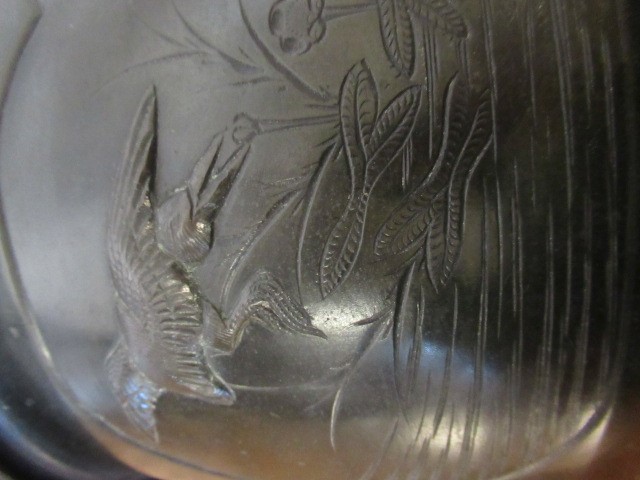 A CHINESE BRONZE JARDINIERE cast in relief with exotic birds set within two panels, flanked by two Image