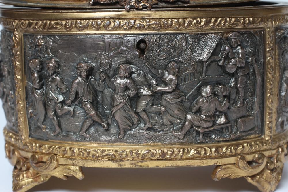 A FRENCH GILDED ORMOLU OVAL JEWELLERY CASKET Image