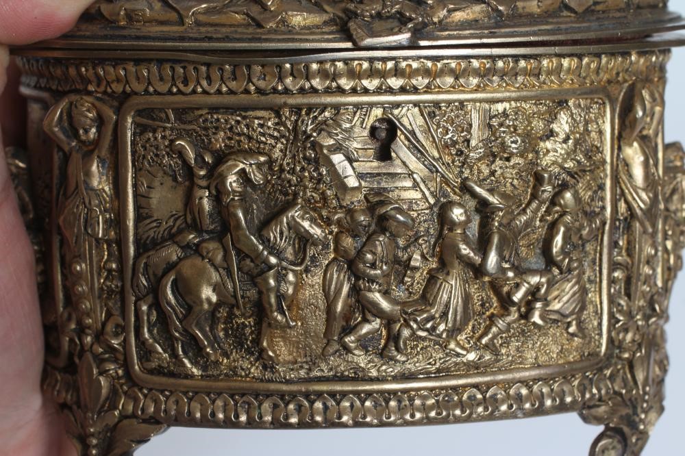 A FRENCH GILDED ORMOLU OVAL MUSICAL JEWELLERY CASKET Image