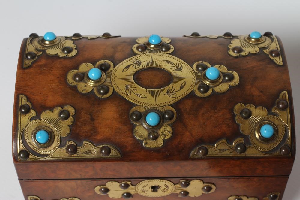 A VICTORIAN FIGURED WALNUT DOMED TEA CADDY with gilt metal mounts and turquoise cabochons Image
