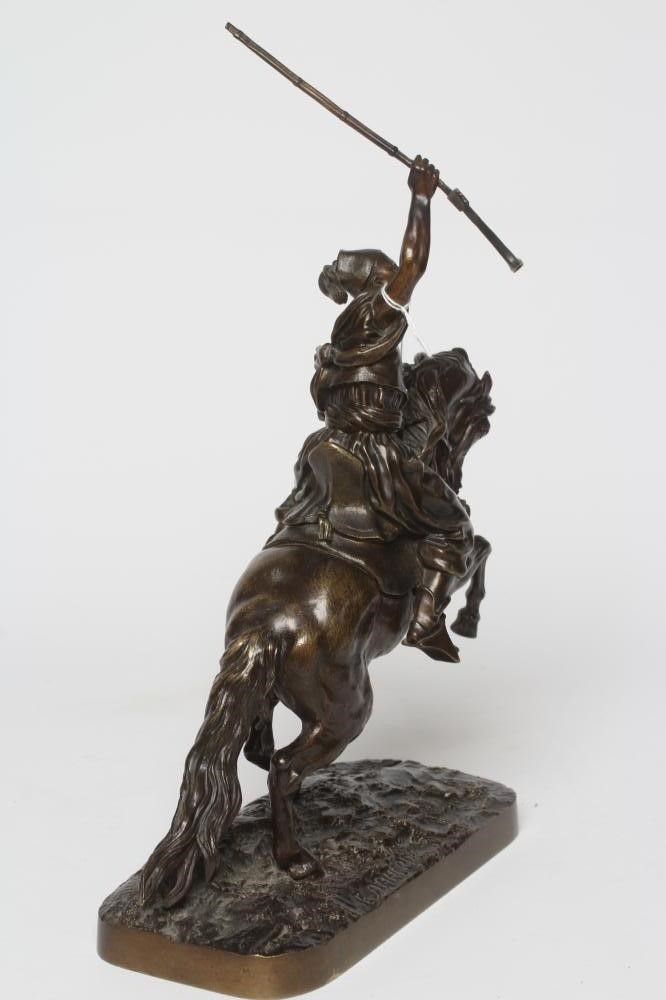 EUGENE LANCERAY (Russian 1848-1886) A horseman with rifle held aloft on a naturalistic base Image
