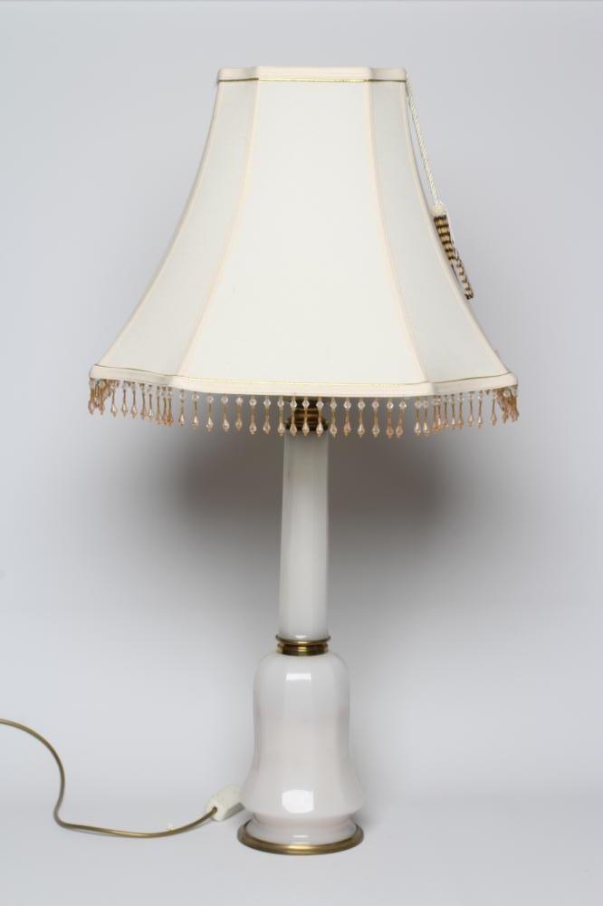 AN OPAQUE WHITE GLASS AND BRASS TABLE LAMP, mid 20th century, with faceted column and bulbous base, Image