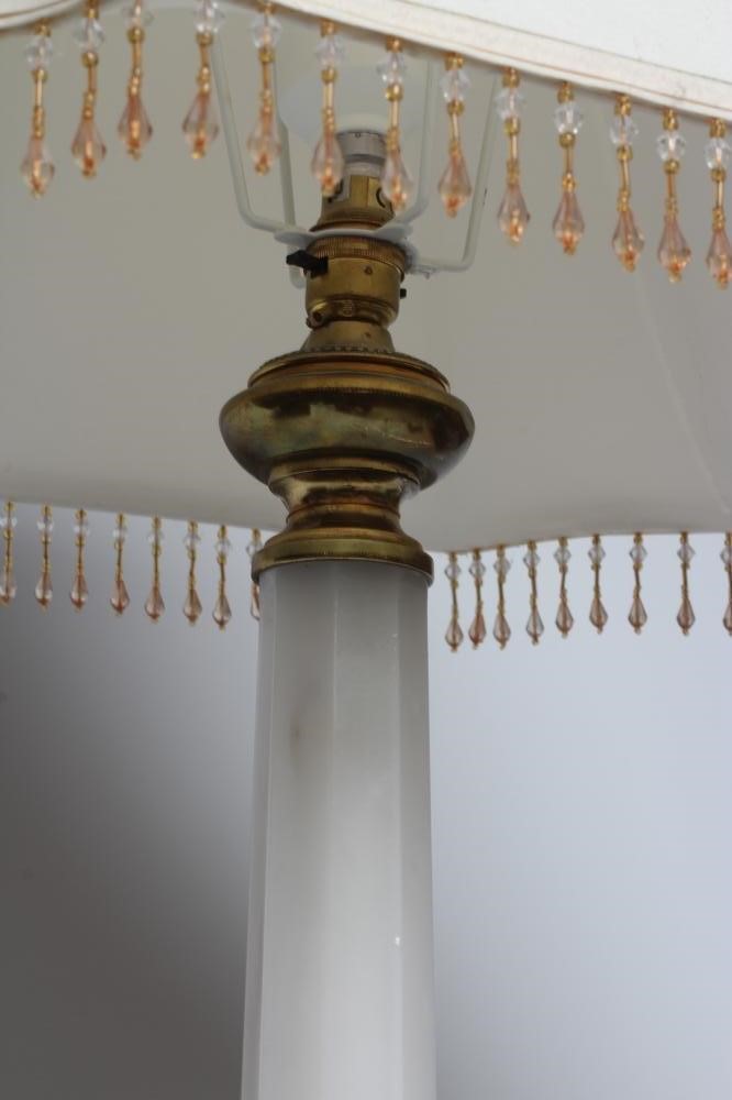 AN OPAQUE WHITE GLASS AND BRASS TABLE LAMP, mid 20th century, with faceted column and bulbous base, Image