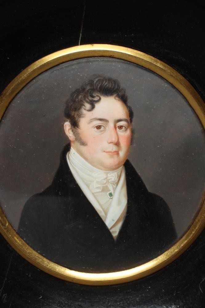 A PAIR OF CIRCULAR IVORY PORTRAIT MINIATURES Image