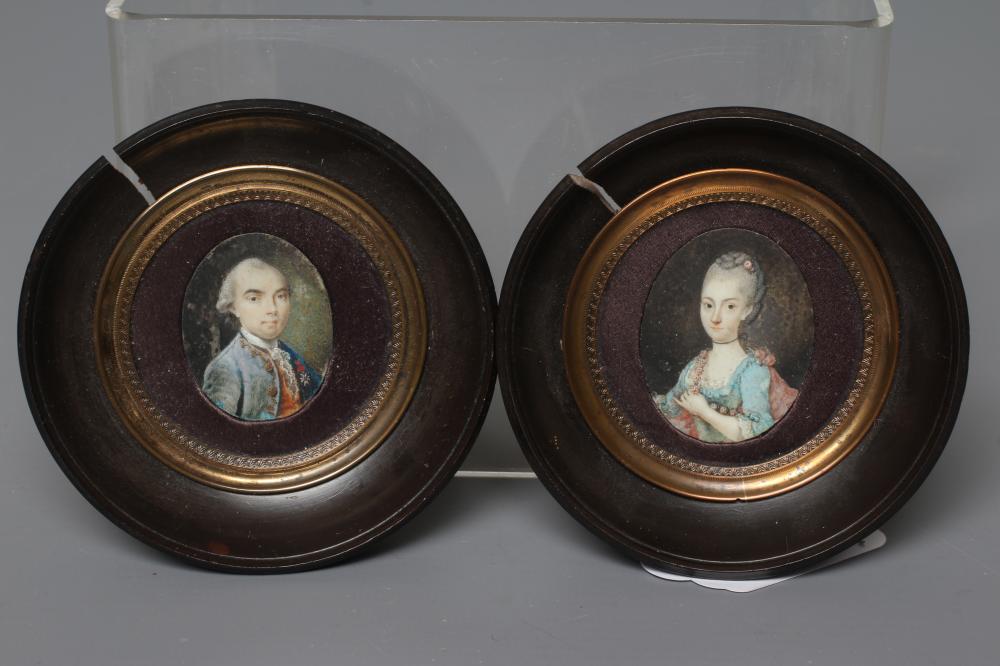 A PAIR OF OVAL IVORY PORTRAIT MINIATURES Image
