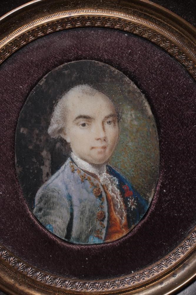 A PAIR OF OVAL IVORY PORTRAIT MINIATURES Image