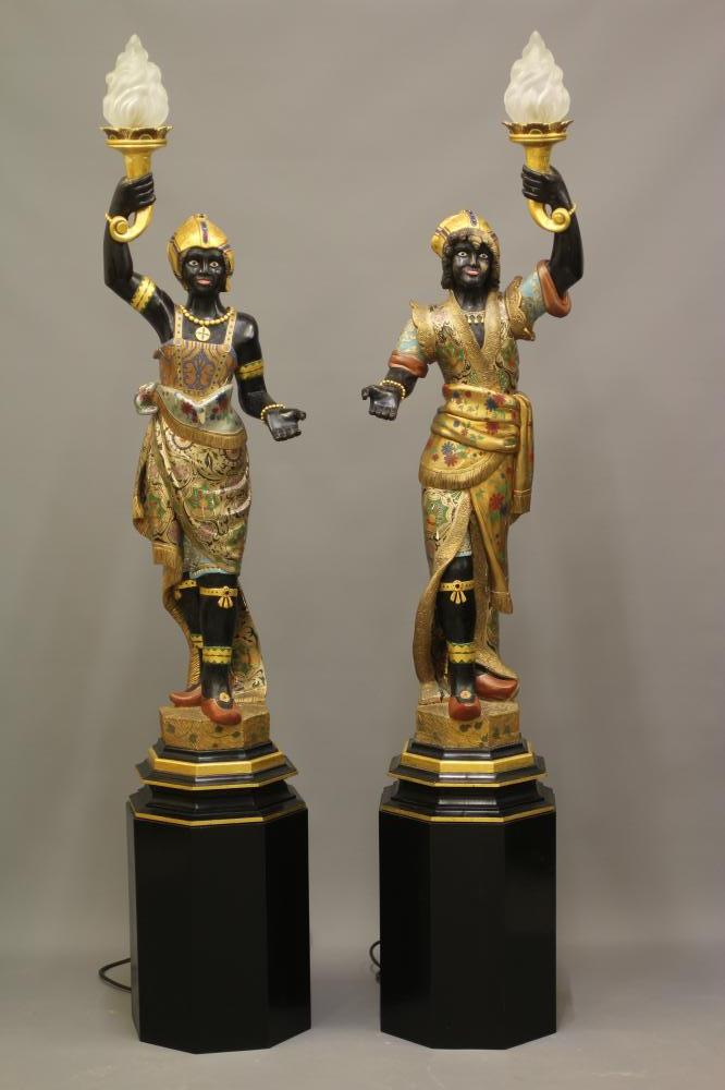 A PAIR OF HAND CARVED POLYCHROME AND GILDED TORCHERE BLACKAMOORS Image