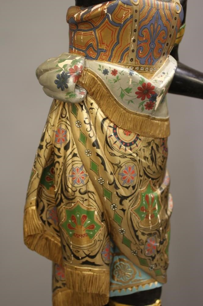 A PAIR OF HAND CARVED POLYCHROME AND GILDED TORCHERE BLACKAMOORS Image